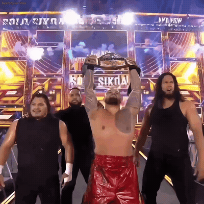 Wrestlers Standing In Front Of And New Sign GIF