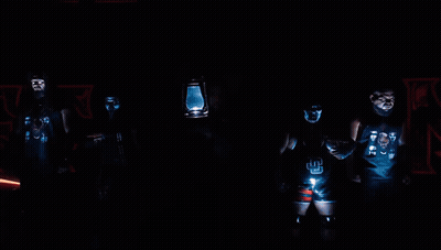 Wrestlers Standing In Front Of Ulti Sign GIF