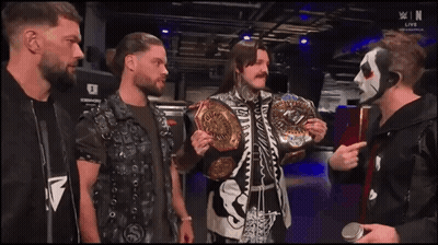Wrestlers Standing With Championship Belt GIF