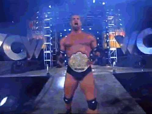 Wrestling Man With Belt In Front Of WVC Sign GIF