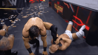 Wrestling Match In Front Of EW Alliance Sign GIF