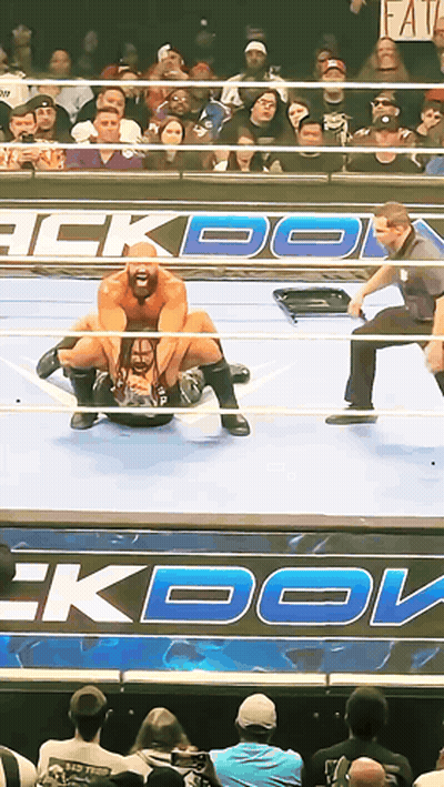 Wrestling Match In Front Of Faith Sign GIF