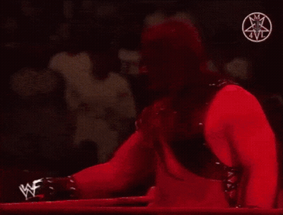 Wrestling Match In Front Of WWE Sign GIF