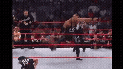 Wrestling Match In Ring With Referee And Crowd GIF