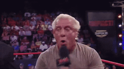 Wrestling Ring Man Talking Into Microphone