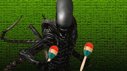 Xenomorph Playing Jingle Stick GIF