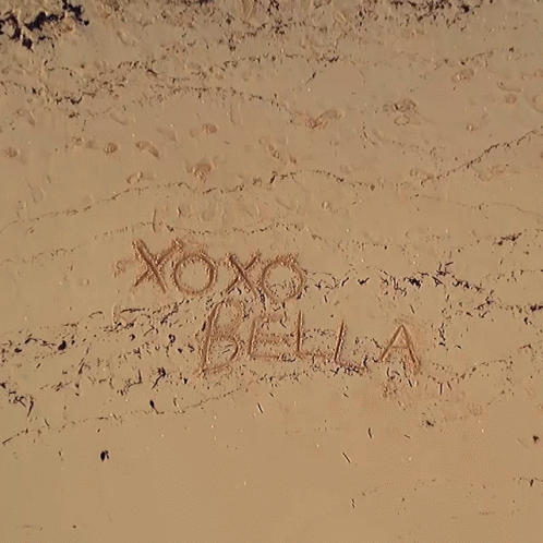Xoxo Bella Written In The Sand On A Beach GIF
