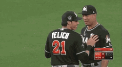 Yelich Victory Laugh With Teammate GIF