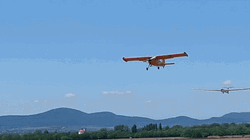 Yellow Airplane Passing By GIF