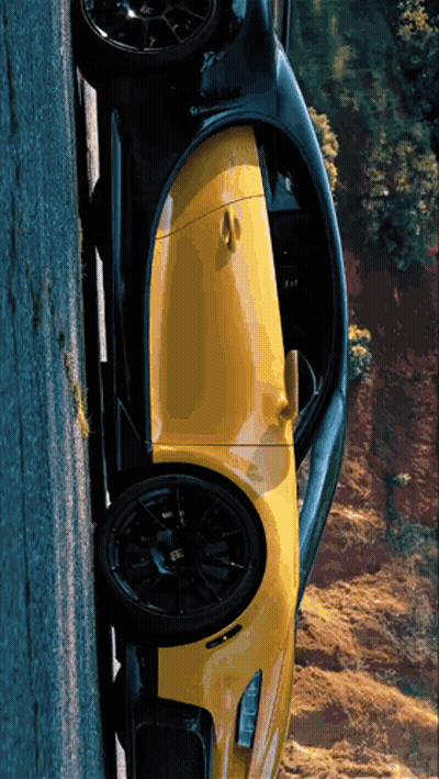 Yellow And Black Sports Car Parked On Road GIF