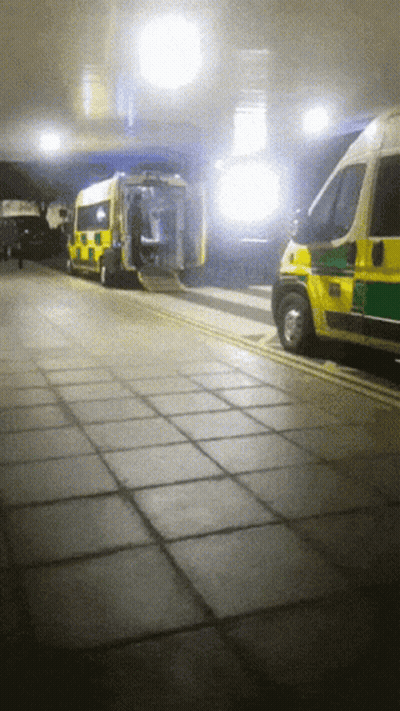 Yellow And Green Ambulance Parked GIF