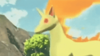 Yellow And Orange Pokémon Standing In Grass GIF