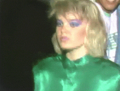 Yellow Brick Wall With Hands Reaching Out GIF