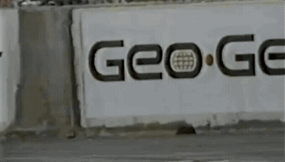Yellow Car Driving Past Go Sign GIF