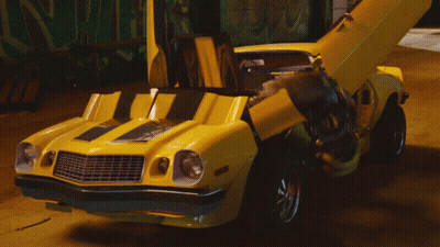 Yellow Car With Hood Open And Transformer On Back GIF