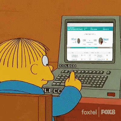 Yellow Cartoon Character Typing On Coleco Computer GIF