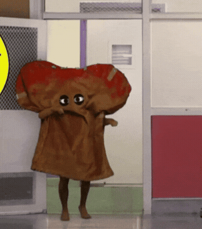 Yellow Cartoon Character With Book And Cupcake On Head GIF
