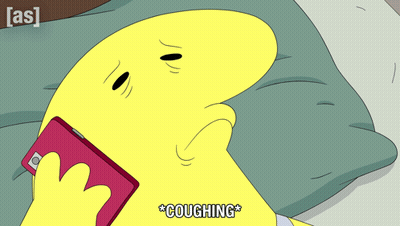 Yellow Cartoon Laying On Bed Holding Cell Phone Coughing GIF