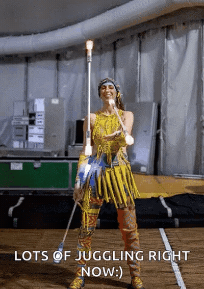 Yellow Dress Woman Juggling Stick Lots Of Juggling GIF