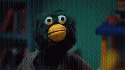 Yellow Duck With Green Hair Holding Stick