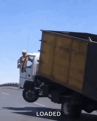Yellow Dump Truck Being Loaded GIF