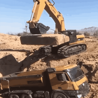 Yellow Dump Truck Loaded With Sand By Excavator GIF
