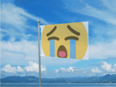 Yellow Flag Flying In Wind Near Ocean GIF