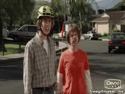 Yellow Helmet Man Next To Red Shirt Man GIF