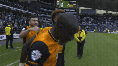Yellow Jacket Man Next To Orange Shirt Man GIF