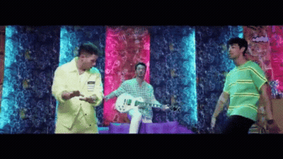 Yellow Jacket Man Playing Guitar Two Dancing Men Colorful Wall GIF