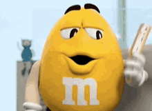 Yellow M And M's Using Fan GIF