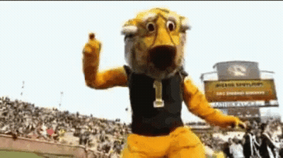 Yellow Mascot With Number 1 In Front Of Crowd GIF