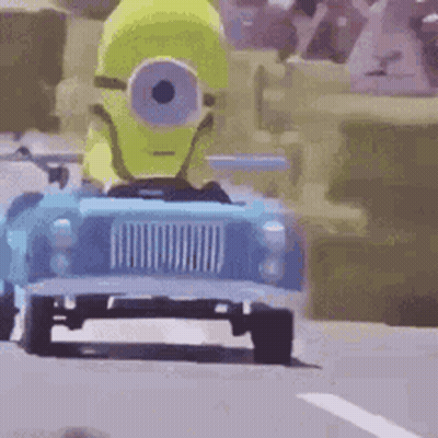Yellow Minion Driving Blue Toy Car GIF