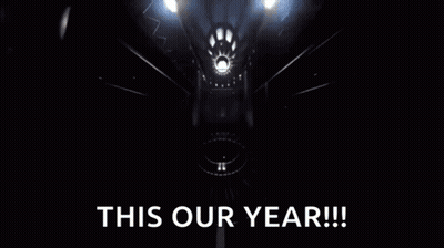 Yellow Object Flying Through Dark Room Saying This Our Year GIF
