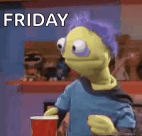 Yellow Puppet With Purple Hair Holding Coffee And Red Cup GIF