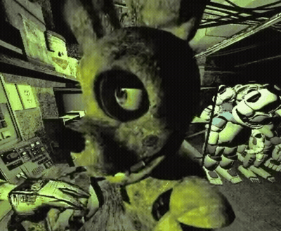 Yellow Rabbit With Large Eye In Dark Room GIF