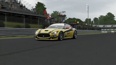 Yellow Race Car Number 23 Driving On Track GIF