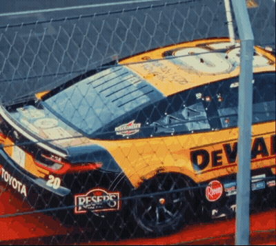 Yellow Race Car With Deval On Side GIF