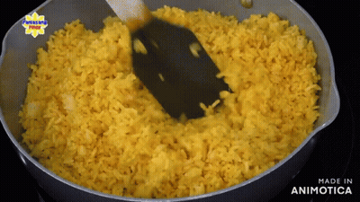 Yellow Rice Being Stirred With Spatula Made In Animotica GIF