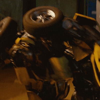 Yellow Robot With Blue Eyes Holding Tire GIF