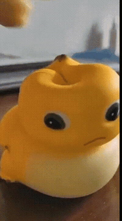 Yellow Rubber Duck With Banana In Mouth GIF