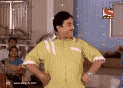 Yellow Shirt Man Dancing Hands Hips Sony Logo GIF
