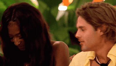 Yellow Shirt Man Talking To Black Top Woman GIF