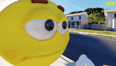 Yellow Smiley Standing In Front Of Stop Sign GIF