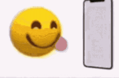 Yellow Smiley With Blue Hat Looking At Cellphone GIF