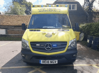 Yellow South East Coast Ambulance Parked In Front Of Building GIF