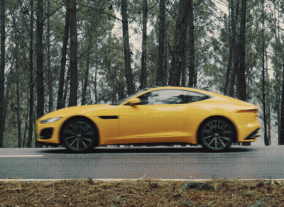 Yellow Sports Car Driving Down Road GIF