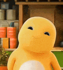 Yellow Stuffed Animal By Shelf Of Cans GIF
