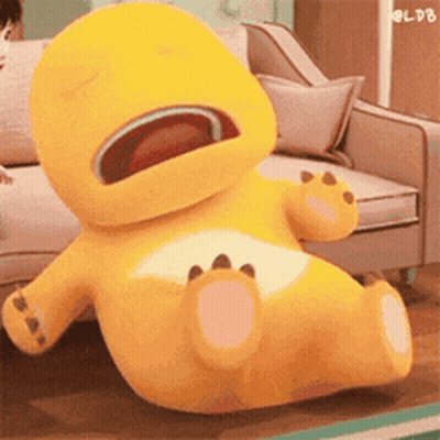Yellow Stuffed Animal Open Mouth On Couch GIF