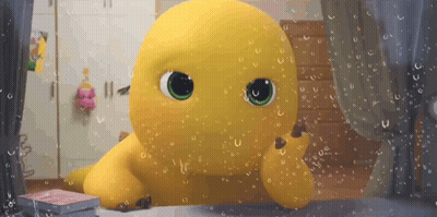 Yellow Stuffed Animal With Green Eyes Looking Out Rainy Window GIF
